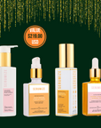 A set of four skincare products, including a serum, moisturizer, cleanser, and dry oil, each in a clearly labeled bottle or container.
